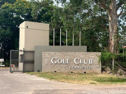 a golf club sign in front of a building at Coruya Wild in Santa Ana