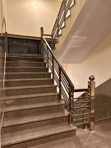 a set of stairs in a building at Hotel Shivalaya by GPH in Haridwār