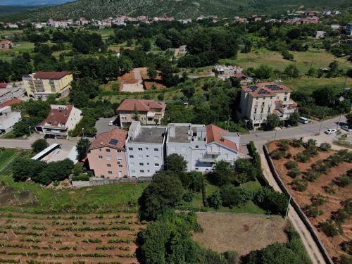 an aerial view of a town with buildings and trees at Pension Silvia in Međugorje