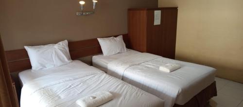 Letto o letti in una camera di Guest House Syariah New Teras Solo