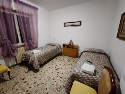 Postel nebo postele na pokoji v ubytování Alloggio per uso turistico Sant'Andrea