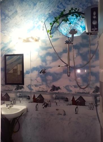 a bathroom with a mural of a sky at Off grid Ella Homestay in Ella