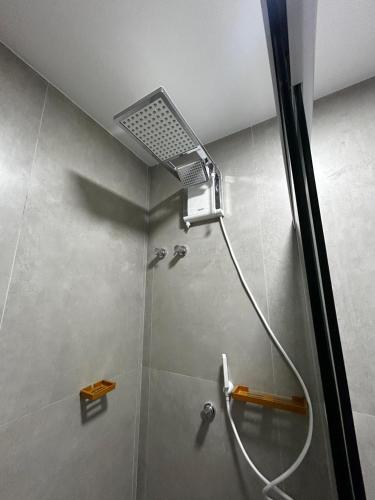 a shower with a shower head in a bathroom at Alive Corredor da Vitória - Vista Mar in Salvador