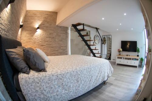 a bedroom with a large bed and a staircase at B&B Carpe Diem vista lago in Castel Gandolfo