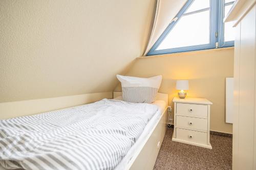Postel nebo postele na pokoji v ubytování Anlage "Heimathafen" Haus Aurora