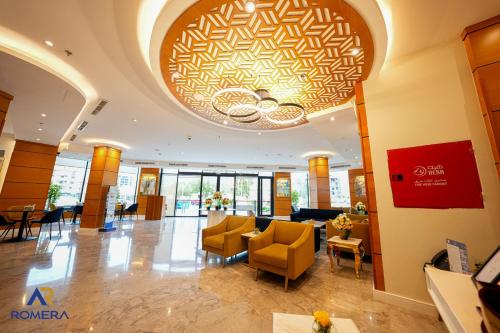a lobby of a hotel with a large ceiling at Romera Hotel in Jeddah