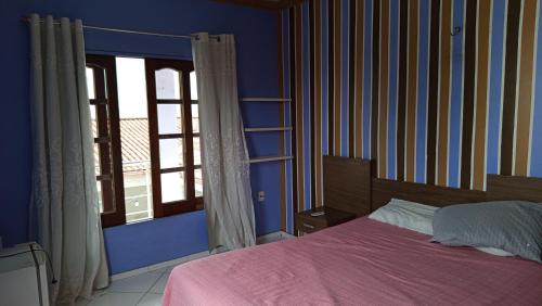 Ένα ή περισσότερα κρεβάτια σε δωμάτιο στο Great House for COP 30 - H01