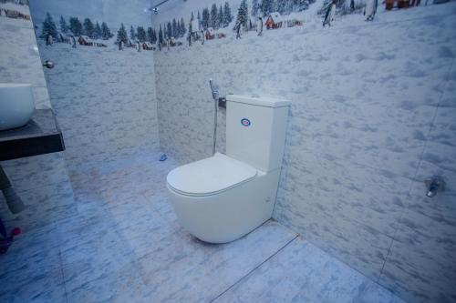 a toilet in a room with snow on the ground at Eleena House in Galle
