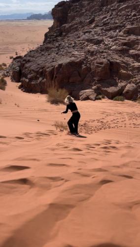 a person in the desert playing with a frisbee at Syndebad desert camp in Wadi Rum