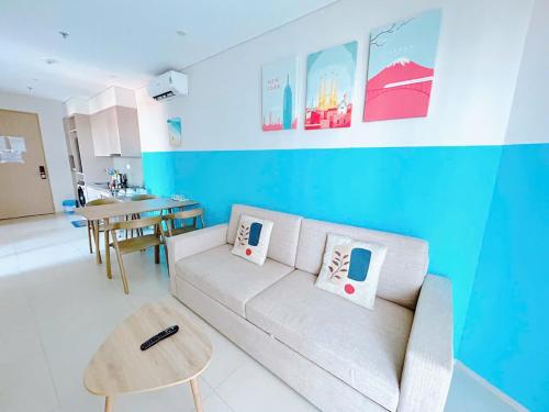 a living room with a couch and a table at The Sóng Vũng Tàu Hideaway in Vung Tau