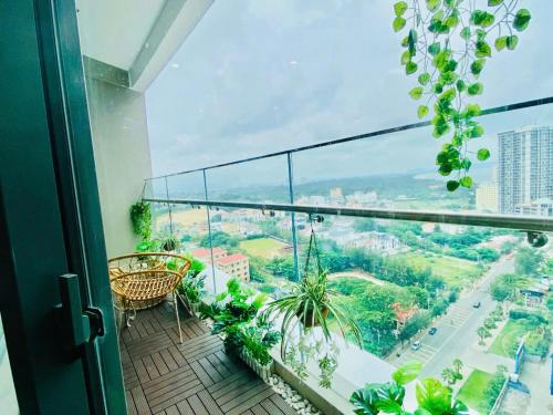a balcony with a view of a city at The Sóng Vũng Tàu Hideaway in Vung Tau