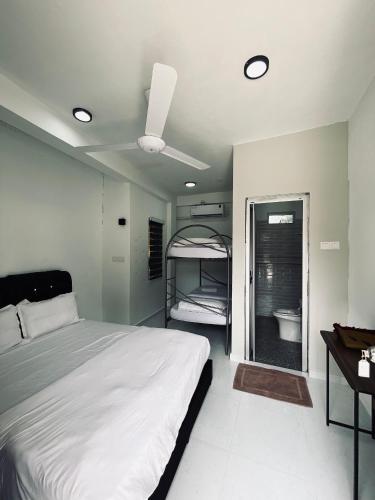 a bedroom with a large bed and a bathroom at CasaView Beach in Paka