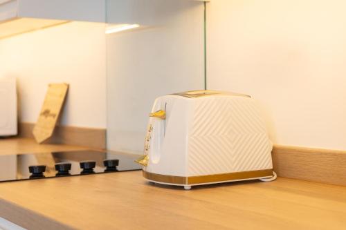 a suitcase sitting on top of a kitchen counter at Apartment 3, King's Court in Scarborough