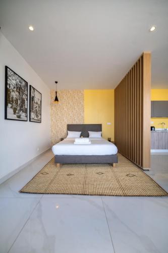Postel nebo postele na pokoji v ubytování AfricaWorks Suites