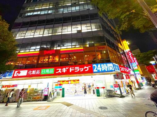 a large building with signs on the side of it at K2 square 502 in Nagoya