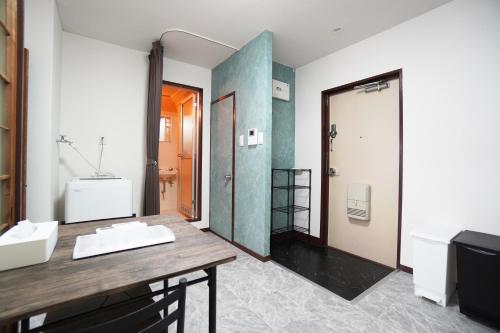 a bathroom with a sink and a shower at Charade Kyobashi in Osaka