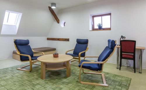a waiting room with chairs and a table at Velehradský dům sv Cyrila a Metoděje Velehrad in Velehrad