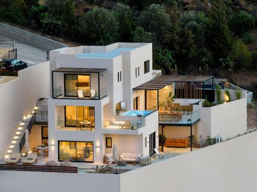 an aerial view of a house with lights at The NooK -Luxury living at the edge of tranquility in Heraklion