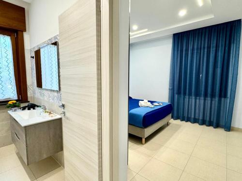 Ένα ή περισσότερα κρεβάτια σε δωμάτιο στο MIRO'S Casa Vacanze Pompei
