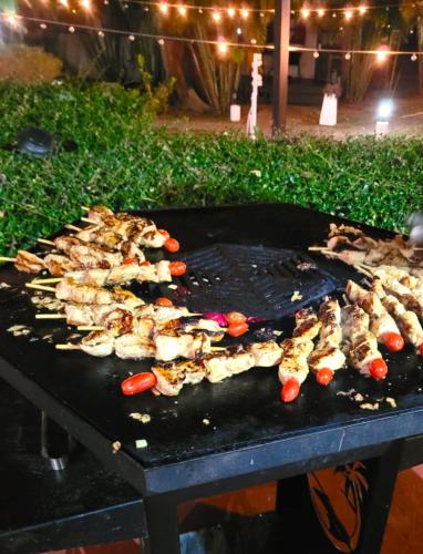 a bunch of food cooking on a grill at Red Moon Hideaway in Ko Chang