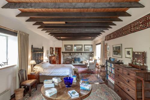 a bedroom with a bed and a wooden ceiling at Lochpatrick Mill in Castle Douglas