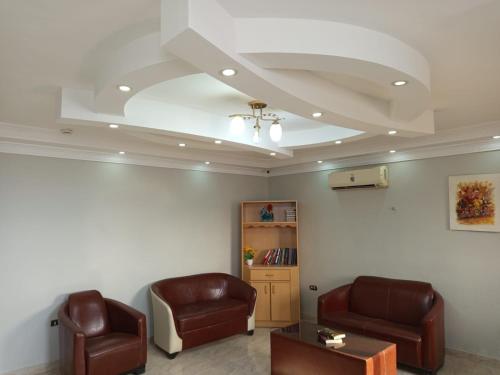 a waiting room with two chairs and a table at Azmal Hotel & Suites in Irbid