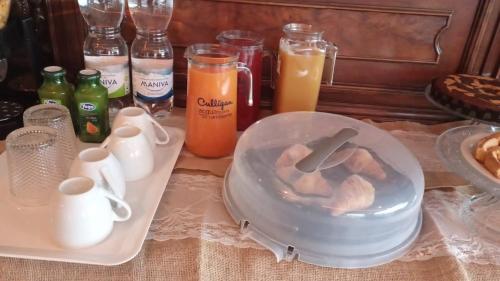 a table topped with a bowl of food and drinks at The Life in Marcellina