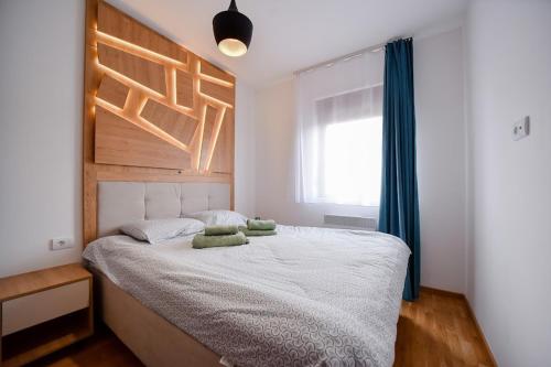 a bedroom with a bed with two pillows on it at Gorski Elegance 2 in Zlatibor