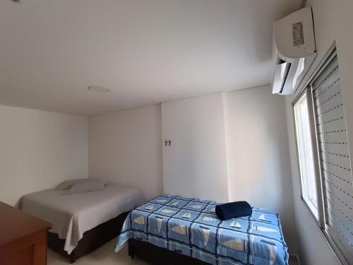 Ένα ή περισσότερα κρεβάτια σε δωμάτιο στο Praia da Guilhermina-PG