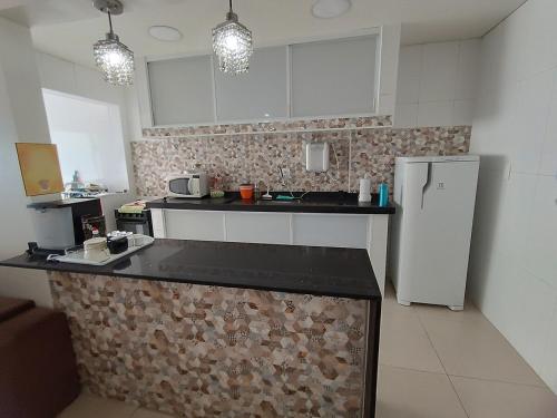 Η κουζίνα ή μικρή κουζίνα στο Praia da Guilhermina-PG