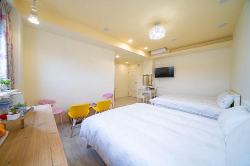 Postel nebo postele na pokoji v ubytování 兆億申襄采民宿1741 Zhao Yì Shen Xiang Cai Homestay 1741