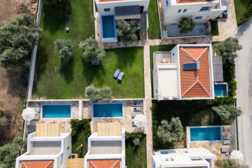 an overhead view of a yard with houses at Magnolia Villas Thassos in Potos