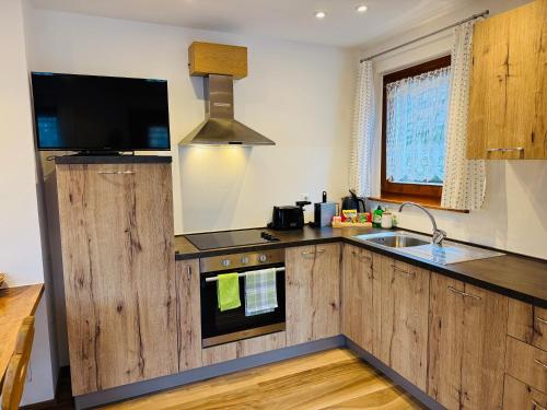 Kuchyň nebo kuchyňský kout v ubytování Chalet Bernardi Apartments