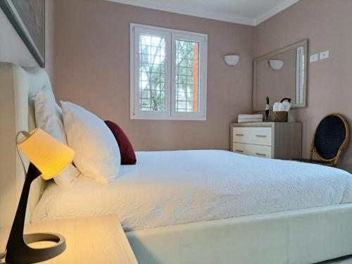 a bedroom with a bed with a lamp on a table at Lion house in Riccione