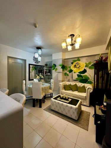 a living room with a couch and a table at Fully furnished 2 bedroom in Camella in Davao City