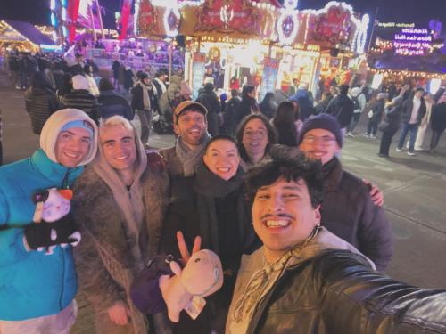a group of people posing for a picture at a carnival at Astor Museum Hostel in London