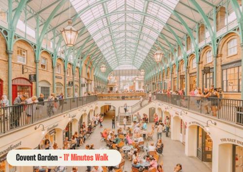 a large crowd of people in a shopping mall at Astor Museum Hostel in London