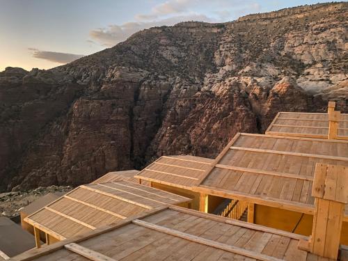 a group of wooden steps on top of a mountain at Dana Trail Hotel in Dana