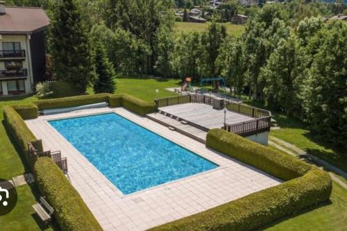 Appartement Megève, piscine et aires de jeux enfants