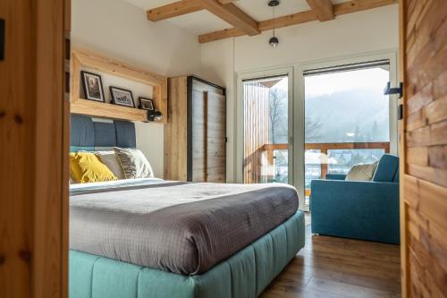 Ένα ή περισσότερα κρεβάτια σε δωμάτιο στο HARLEY FAMILY APARTAMENT - SKY