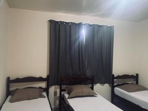 Katil atau katil-katil dalam bilik di Hotel Coutinho Pio XII