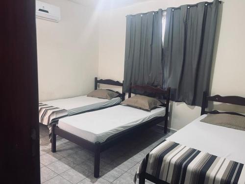 Katil atau katil-katil dalam bilik di Hotel Coutinho Pio XII