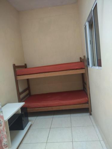 Katil atau katil-katil dalam bilik di Casa Ilha Comprida