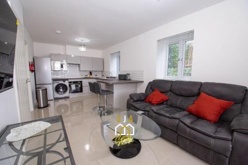 a living room with a couch and a table at Affleck Retreat 4 - SJA Stays - Modern 1 Bed Apartment in Aberdeen