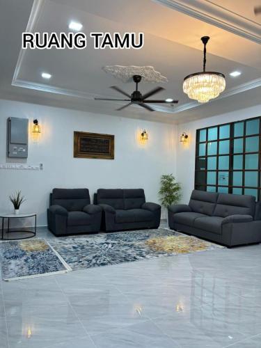 Χώρος καθιστικού στο Homestay Teratak Kediaman Aishah