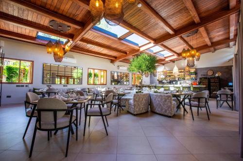 a large dining room with tables and chairs at Pax Manor Muthaiga in Nairobi