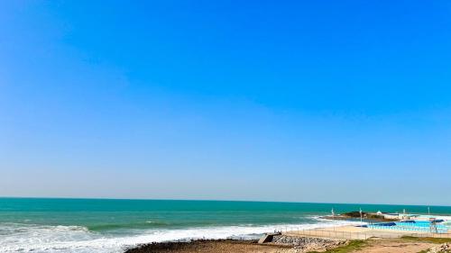 a view of the ocean from the beach at N28 Rabat Corniche Appartement Moderne à Deux Pas de la Mer in Rabat