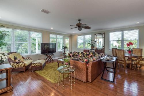 a living room with a couch and a table at Tropical Sands on Anna Maria Island in Holmes Beach
