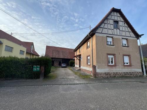 an old building on the side of a street at Douceur in Herrlisheim