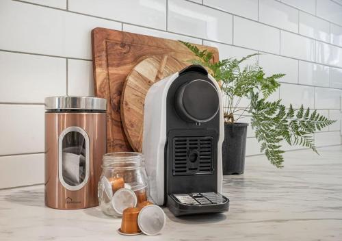 a toaster sitting on top of a kitchen counter at Inner City Location, Modern & Stylish #6 -By KOSH BNB in Hamilton